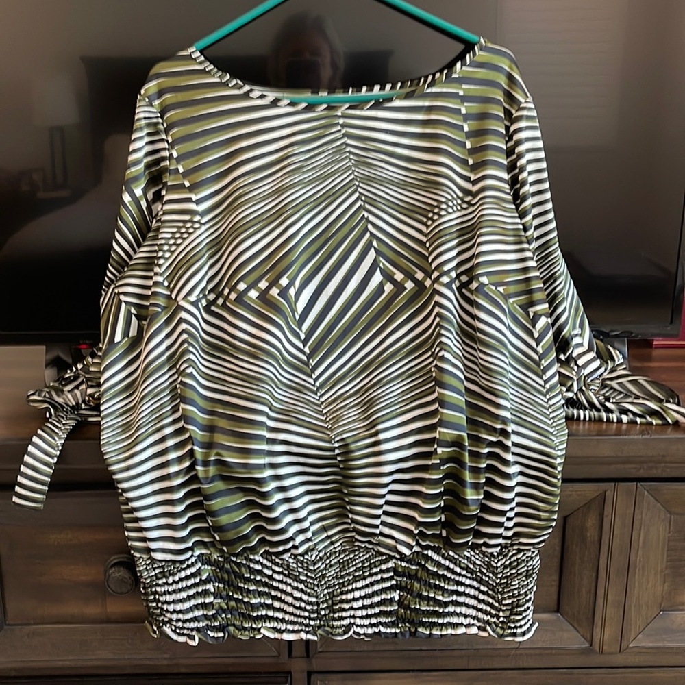 Women’s spandex and polyester top. Machine wash and dry